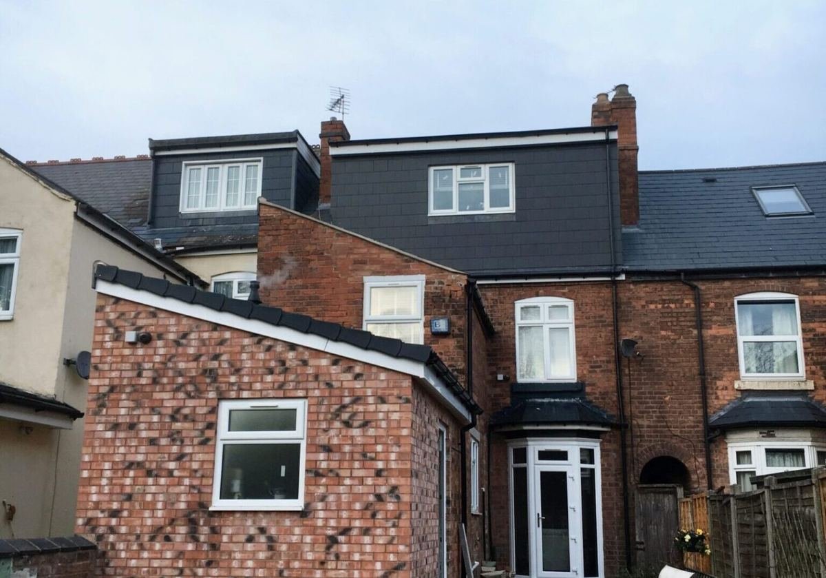 Rear view of a terraced house with dormer loft extensions, converted by HK Builders Ltd