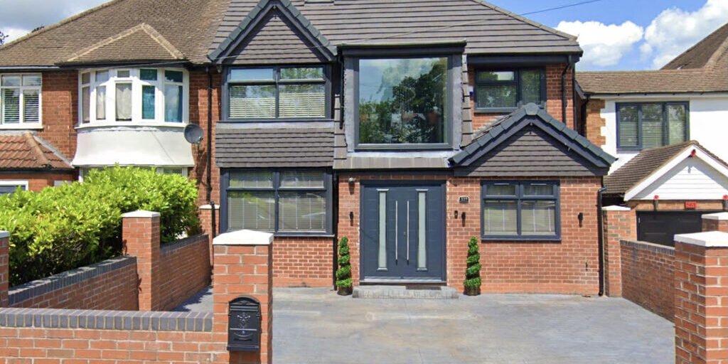 Completed loft conversion with dormer window on a brick house, built by HK Builders Ltd