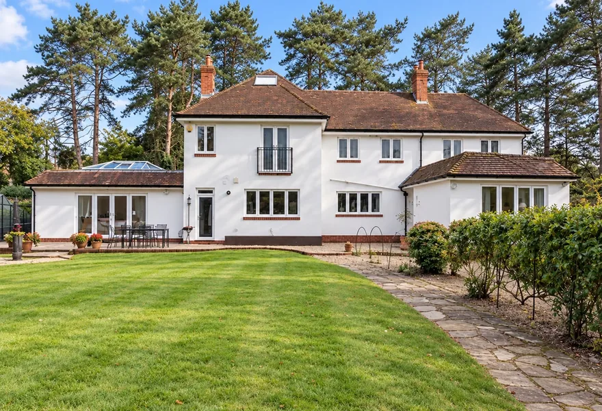 Rear of a detached house with a single storey rear extension and garden