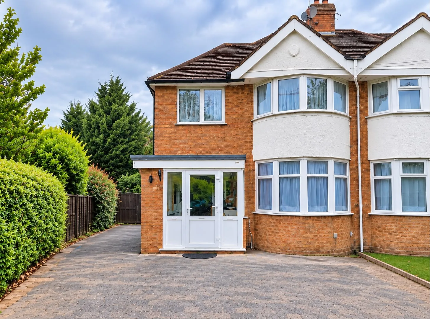 Semi-detached house with a new front porch extension