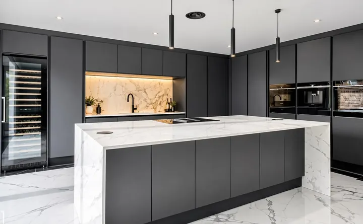 Modern dark kitchen with a marble island and wine cooler